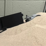 A tugging controller that maximizes lateral resistive force by mounding sandy terrain